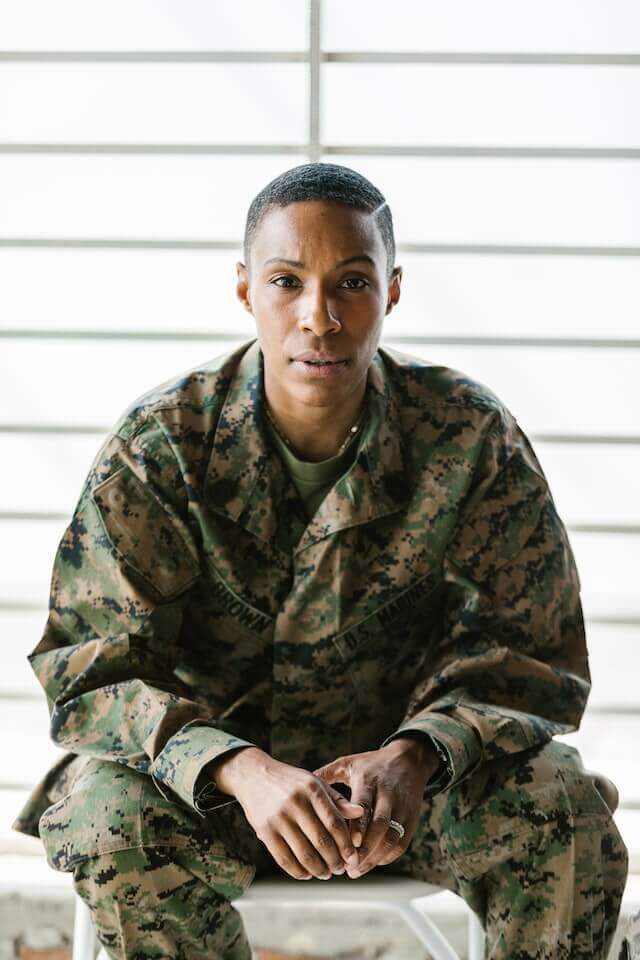 Woman in Green and Brown Camouflage Uniform