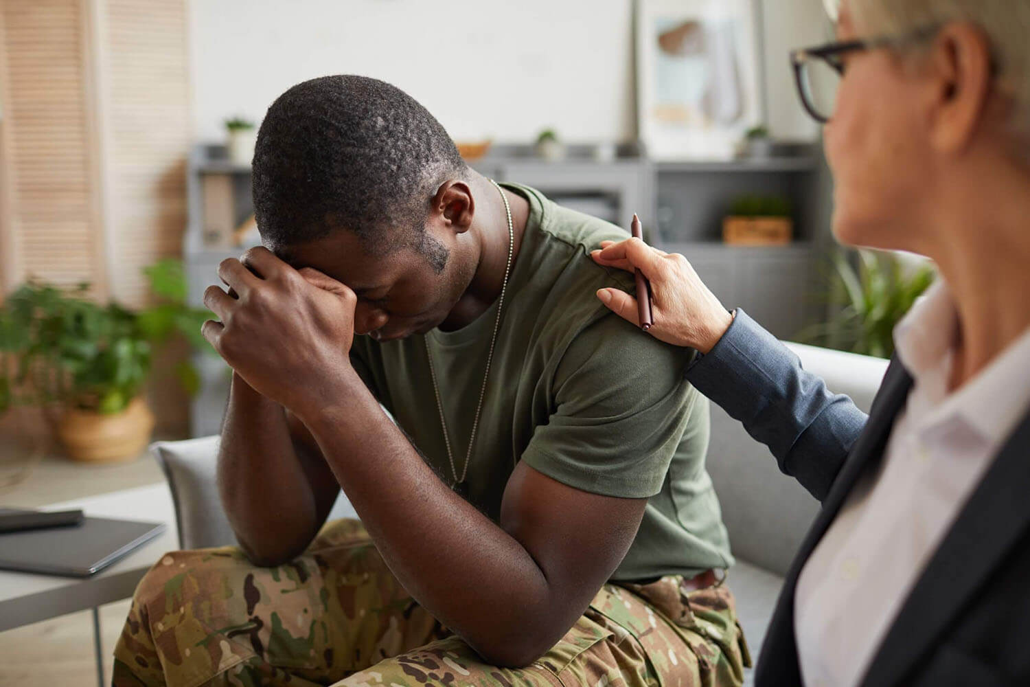 Military veteran praying.