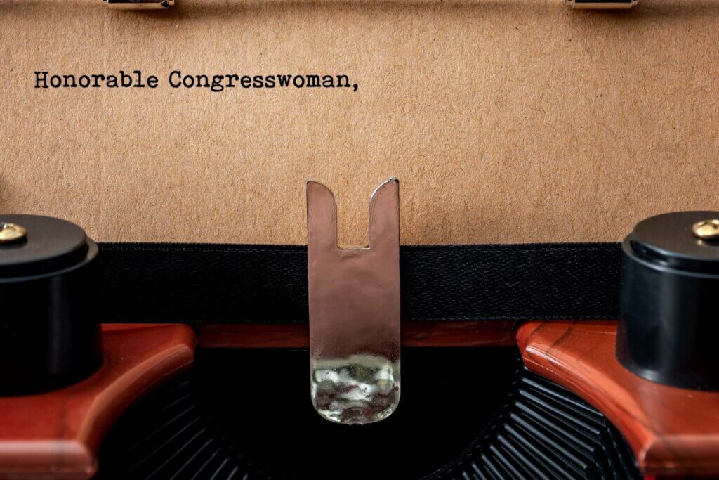 Photo of typewriter with paper that says Dear Congresswoman